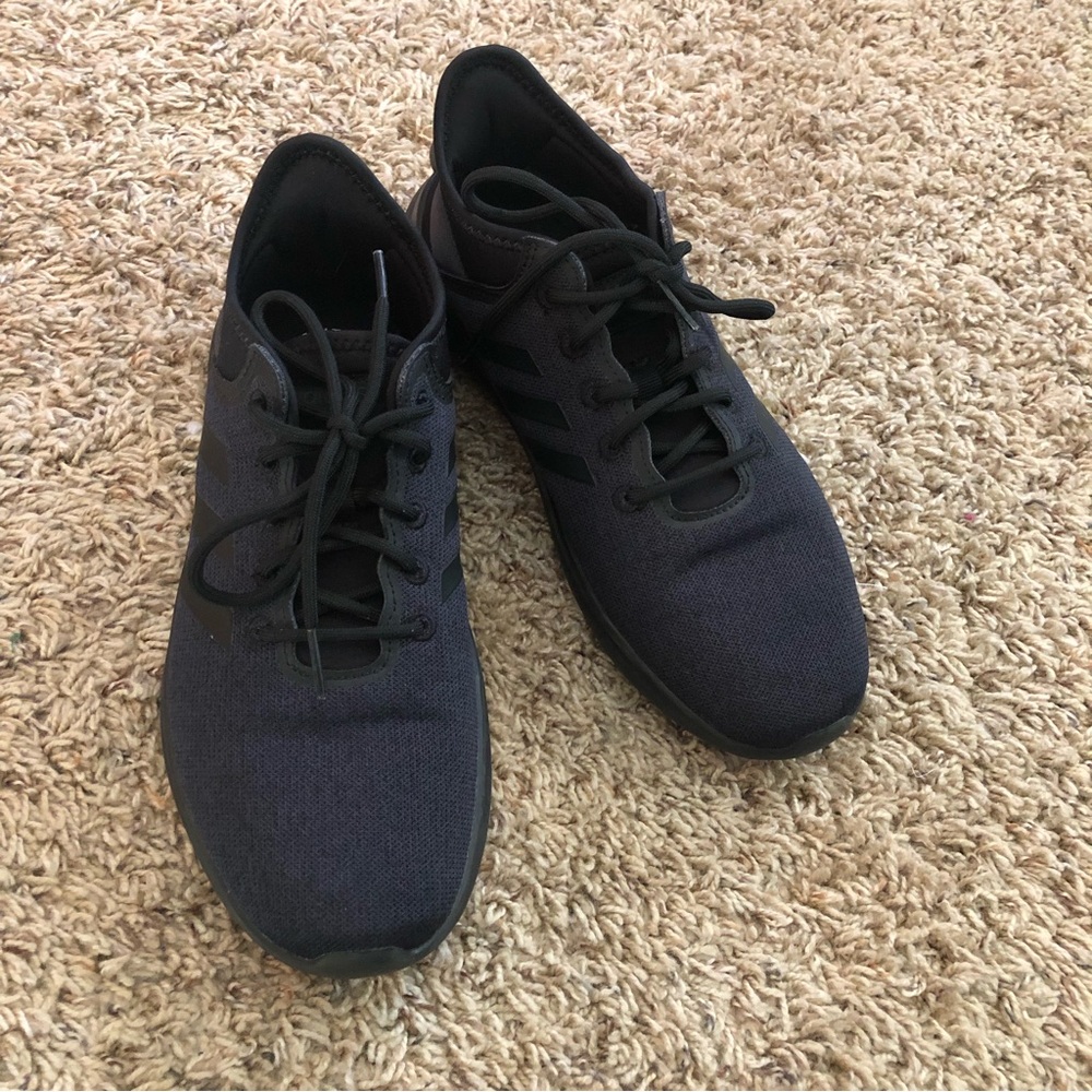 Black adidas athletic shoes